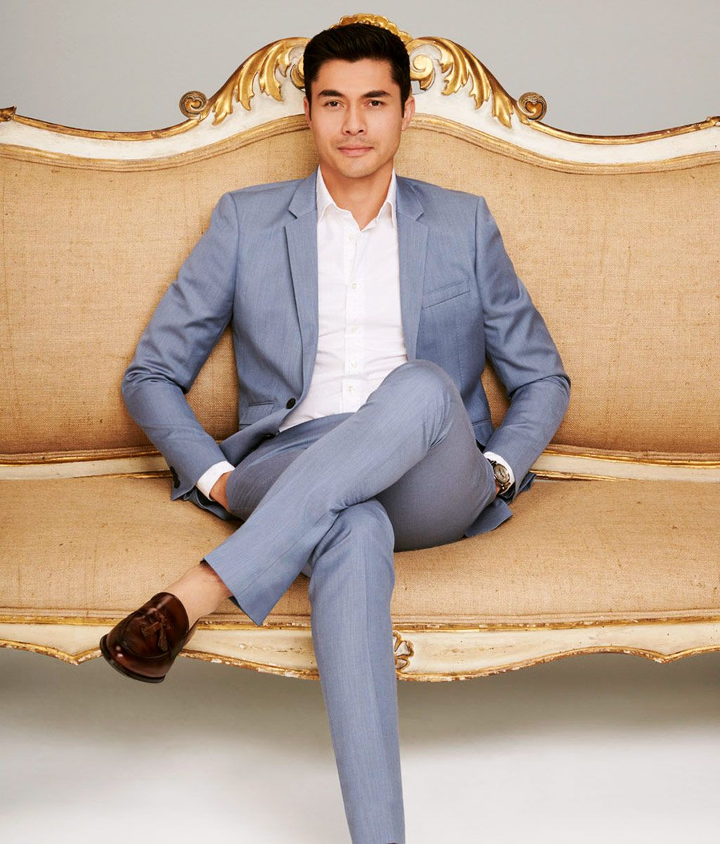Henry Golding in a suit