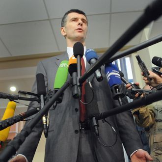 Russian billionaire Mikhail Prokhorov speaks to the media after receiving his certificate of presidential candidate in the Central Elections Commission office in Moscow, on January 25, 2012