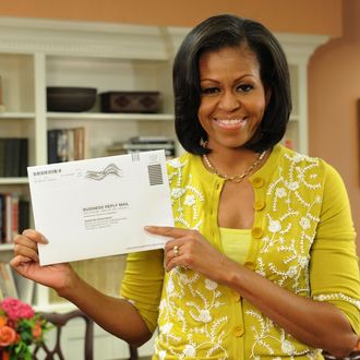 Washington, DC, USA-First Lady Michelle Obama prepares her absentee ballot for the upcoming elections.
OFA/Jocelyn Augustino?2012