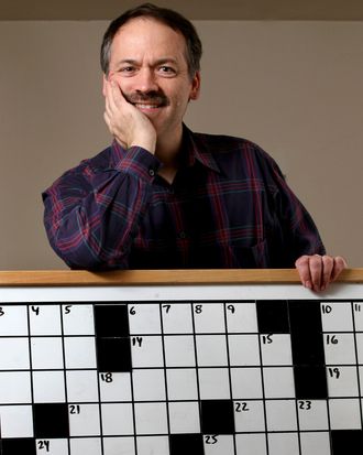 Will Shortz, founder of the American Crossword Puzzle Tournament and the New York Times's puzzle editor, poses Saturday, Feb. 23, 2008 in his Pleasantville, New York home with the contest board that is used during the competition that starts Feb. 29. Shortz hopes there will be more contestants and onlookers as it moves to Brooklyn, New York from 30 years at the former site in Stamford, Connecticut. Photographer: Craig Ruttle/Bloomberg News