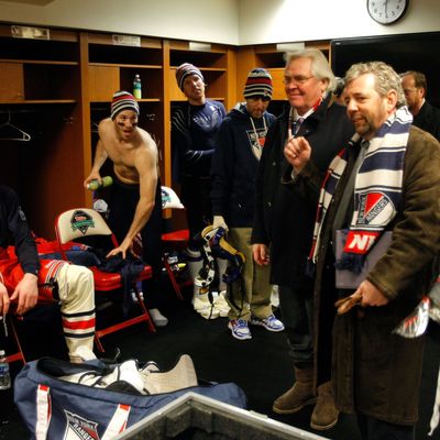 Glen Sather and James Dolan speak to the New York Rangers after they defeated the Philadelphia Flyers in the 2012 Winter Classic.