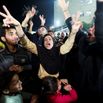 Palestinians react to news on a ceasefire deal with Israel, in Deir Al-Balah in the central Gaza Strip