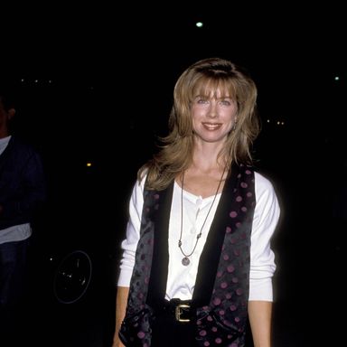 Bruce Springsteen's ex and future Sisters co-star Julianne Phillips is smiling the smile that only someone fresh off playing Chevy Chase's love interest in Fletch Lives can smile.