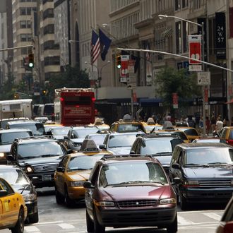 Cars, taxis and trucks sit in traffic in midtown Manhattan 15 August 2007 during the morning rush hour. The federal government has given New York City Mayor Michael Bloomberg a postdated check of 354 million USD for his plan to ease city traffic through new tolls if he can win the approval of local lawmakers.The plan if enacted, calls for charging 8 USD to drive a car into Manhattan south of 86th street on weekdays between 6 a.m. and 6 p.m (1800 GMT) and trucks would pay 21 USD. It would be the first city in the United States to have such a toll. AFP PHOTO TIMOTHY A. CLARY (Photo credit should read TIMOTHY A. CLARY/AFP/Getty Images)