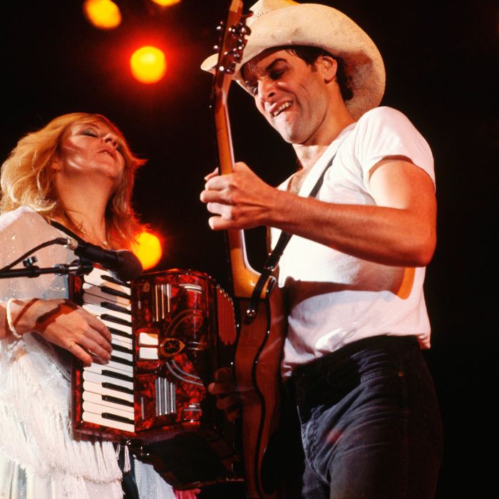 August 31 or September 1, 1980 --- Christine McVie and Lindsey Buckingham perform on stage during a concert.