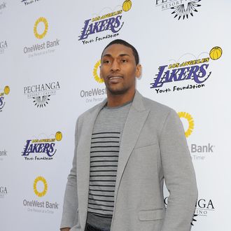 Metta World Peace #15 of the Los Angeles Lakers walks the purple carpet prior to attending Lakers Casino Night at Club Nokia at LA Live on March 10, 2013 in Los Angeles, Califronia. 