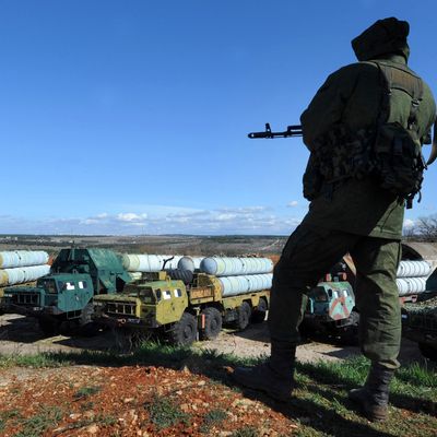 A member of the Russian forces guards in front of surface-to-air S300 missiles in a Ukrainian anti-aircraft missile unit on the Cape of Fiolent in Sevastopol on March 5, 2014. A military source has told Interfax-Ukraine that Russian commandos have seized control of the anti-aircraft missile systems and are guarding them.