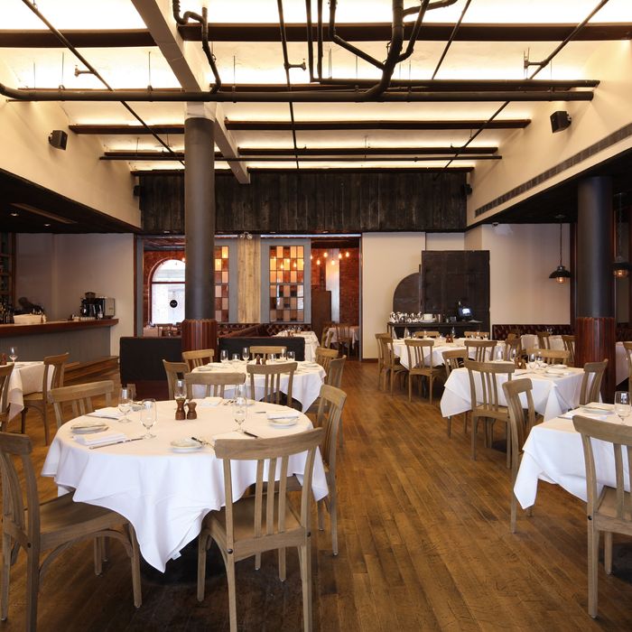 The refurbished dining room takes cues from the space's industrial past.