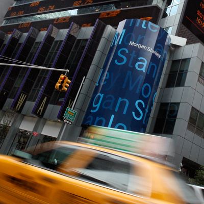 FILE - In this file photograph taken July 19, 2010, traffic passes the headquarters of Morgan Stanley in New York. Of the 1,600 job cuts announced earlier in Dec. 2011 by Morgan Stanley, 580 will be at its home base in New York. (AP Photo/Richard Drew, file)