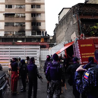 Security forces and members of the Sebin intelligence service check a nearby building after an explosion was heard while Venezuelan President Nicolas Maduro was attending a ceremony to celebrate the 81st anniversary of the National Guard, in Caracas on Saturday.