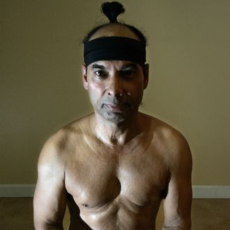 Yoga master Bikram Choudhury assumes the lotus position.