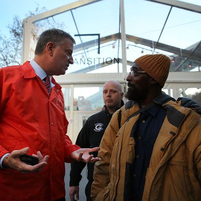 NEW YORK, NY - NOVEMBER 20: New York City Mayor-elect Bill de Blasio takes a question from a man about 