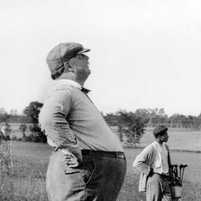 ca. 1890-1910 --- President William Howard Taft, known as much for his bulk as his office, stands in profile during a day on the golf course. Taft served as President for one term (1908-1912). --- Image by ? CORBIS