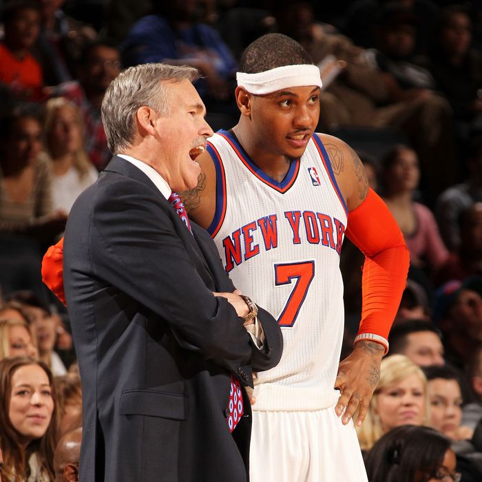 Mike D'Antoni of the New York Knicks talks to Carmelo Anthony #7 during the fourth quarter of a game against the Toronto Raptors on January 2, 2012 at Madison Square Garden in New York City.