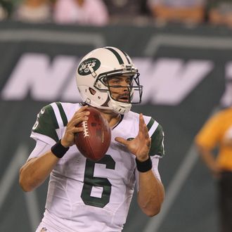 Quarterback Mark Sanchez #6 of the New York Jets drops to pass against the Jacksonville Jaguars at MetLife Stadium on August 17, 2013 in East Rutherford, New Jersey. 