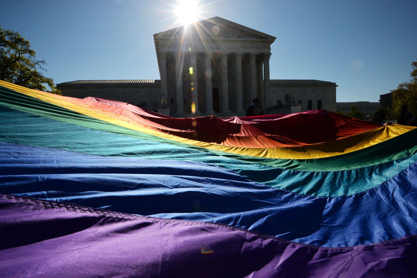 Both Sides of the Same-Sex Marriage Case Duel With Signs and Slogans  Outside the Supreme Court
