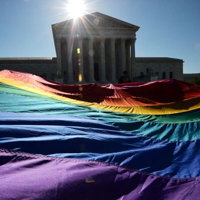 Supporters of same-sex marriages gather outside the US Supreme Court waiting for its decision on April 28, 2014 in Washington, DC. The US Supreme Court is hearing arguments on whether gay couples have a constitutional right to wed -- a potentially historic decision that could see same-sex marriage recognized nationwide. 