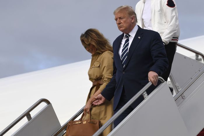 First Lady Melania Trump refuses to hold President Donald Trump's hand as they walk down the steps of Air Force on on August 16, 2020.
