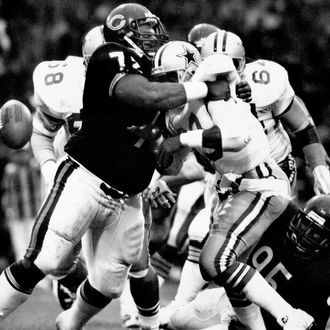 Chicago defensive tackle William Perry of the Chicago Bears tackles Hall of Fame running back Tony Dorsett of the Dallas Cowboys in a17-6 Chicago win on August 3,1986 in an American Bowl at Wembley Stadium in London, England.