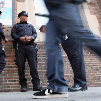 New York Police Department officers keep watch outside the 92nd Street Y, a Jewish institution, in Manhattan on March 20, 2012 in New York City. Extra security has been added to Jewish sites around the city following yesterday's attack on a Jewish school in France that killed four people.