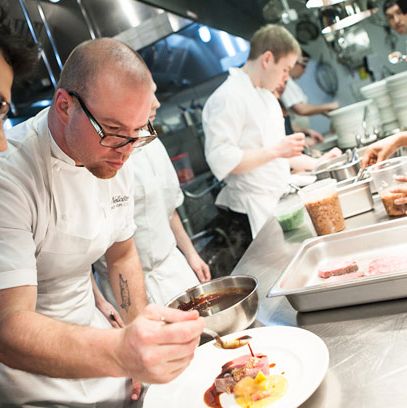 Chef Jared Van Camp sauces the ribeye before pickup.