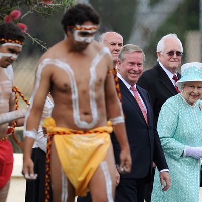 Queen Elizabeth II watching aboriginal dancers during her visit to Clontarf Aboriginal college in Perth, Australia yesterday.