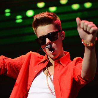 Recording Artist Justin Bieber performs onstage during 93.3 FLZ's Jingle Ball 2012 at Tampa Bay Times Forum on December 9, 2012 in Tampa, Florida.