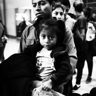 A Guatemalan father and his daughter at a bus station following release from Customs and Border Protection in McAllen, Texas.