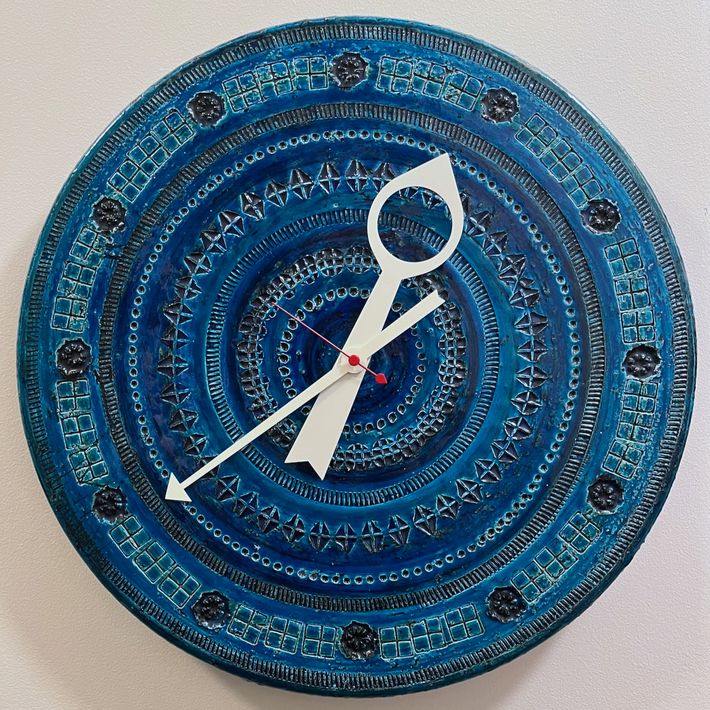 Howard Miller clock model 7552, with ceramic face by Bitossi.