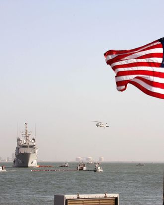 A US Navy Ocean Tug ship and a helicopter of the Bahrain-based Fifth Fleet particpate in a crisis response exercise in a port in the capital Manama, 06 November 2007.