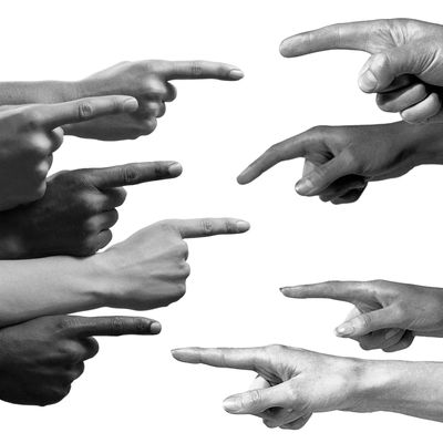 5 pointing fingers of multiple ethnicities