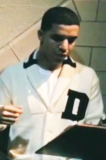 Right off the bat, in his first big music video, Drake busts out one hell of a conspicuous sweater: a fifties doo-wop-crooner-enjoying-a-lazy-Sunday-afternoon-type number, emblazoned with a prominent, appropriate "D." The effect is partially blunted by the fact that Drake is in character here for the video, as the motivational coach of the most buxom woman's basketball team in history. It wouldn't take long, however, for Drake to feel comfortable in his own sweater-skin.