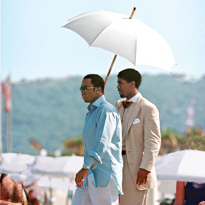 Mandatory Credit: Photo by BEImages (588594h)Sean 'P. Diddy' Combs and Farnsworth BentleySean 'P. Diddy' Combs at Club 55July 27, 2001 - Saint Tropez, FranceSean 'P. Diddy' Combs and Farnsworth Bentley (holding umbrella) at Club 55.Photo ? Ghost/Maxppp/BEImages***U.S. SALES ONLY!***