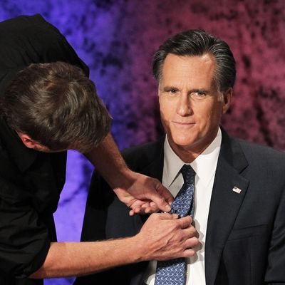 HANOVER, NH - OCTOBER 11: Former Massachusetts Gov. Mitt Romney prepares for the Republican Presidential debate hosted by Bloomberg and the Washington Post on October 11, 2011 at Dartmouth College in Hanover, New Hampshire. Eight GOP candidates met for the first debate of the 2012 campaign focusing solely on the economy. (Photo by Justin Sullivan/Getty Images)