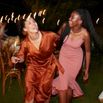 Cheerful woman and teenage girl dancing at reception