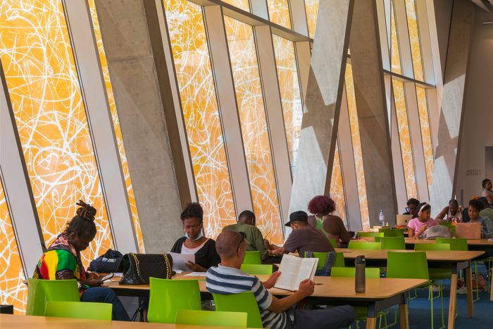 The tinted glass walls give the light an amber glow.