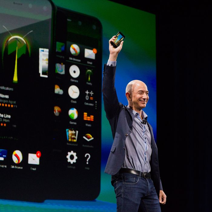Jeff Bezos, chief executive officer of Amazon.com Inc., unveils the Fire Phone during an event at Fremont Studios in Seattle, Washington, U.S., on Wednesday, June 18, 2018. Amazon.com Inc. jumped into the crowded smartphone market with its own handset called Fire Phone, ramping up competition with Apple Inc. and Samsung Electronics Co. Photographer: Mike Kane/Bloomberg via Getty Images