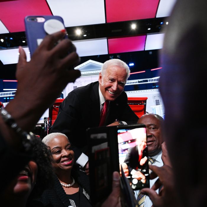 Presidential candidate Former vice president Joe Biden poses for photos on stage at the conclusion of the Washington Post and MSNBC fifth Democratic presidential primary debate at the from Tyler Perry Studios on November 20, 2019 in Atlanta, Georgia.