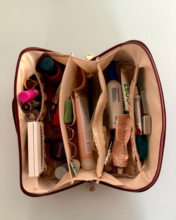 Picture of the makeup organizer laid flat with products inside.