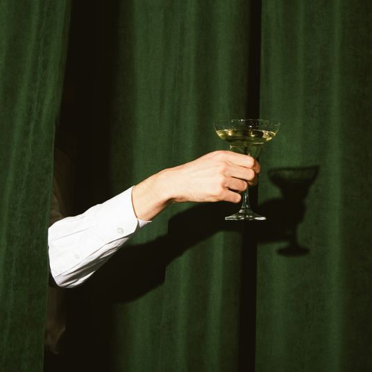 Hand with a martini glass