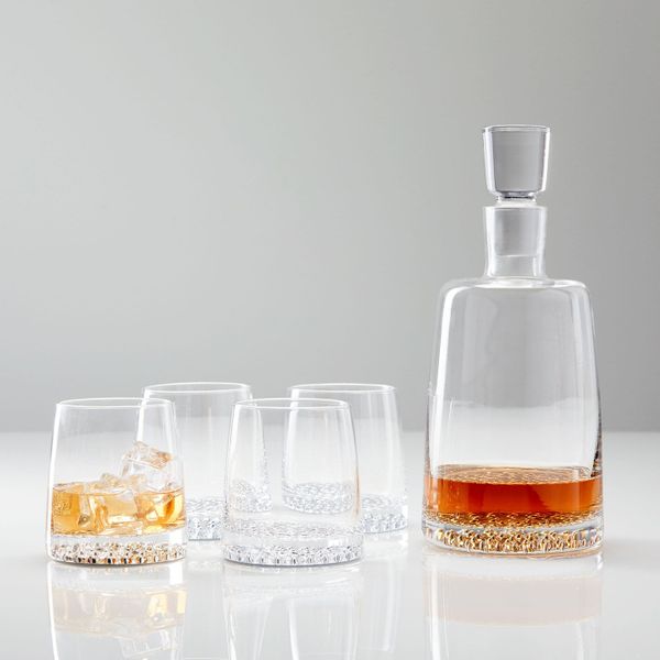 West Elm decanter and glassware set with a metal base