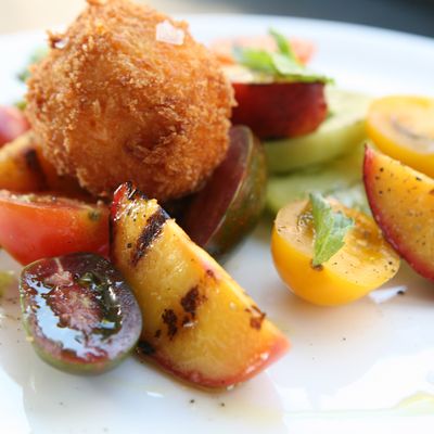 Root & Bone's tomato salad with fried pimento cheese and peaches.