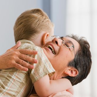 Grandmother hugging grandson