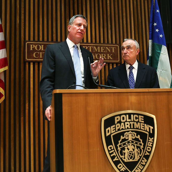New York City Mayor Bill de Blasio (left) speaks at his first news conference with police commissioner William Bratton at One Police Plaza on January 2, 2014 in New York City. New York City, and much of New England is preparing for a major winter snowstorm.