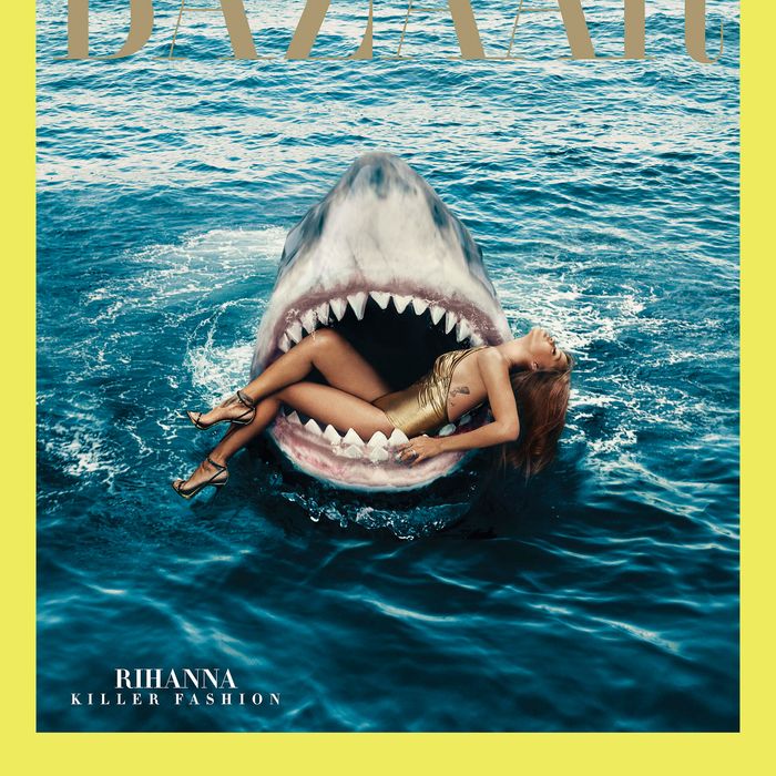Rihanna poses in the mouth of a shark.