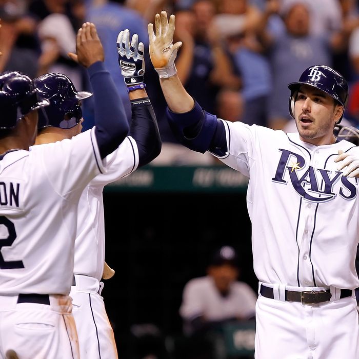 ST. PETERSBURG, FL - SEPTEMBER 27: B.J. Upton #2 and Evan Longoria #3 of the Tampa Bay Rays congratulate Matt Joyce #20 after his three run home run against the New York Yankees during the game at Tropicana Field on September 27, 2011 in St. Petersburg, Florida. (Photo by J. Meric/Getty Images)