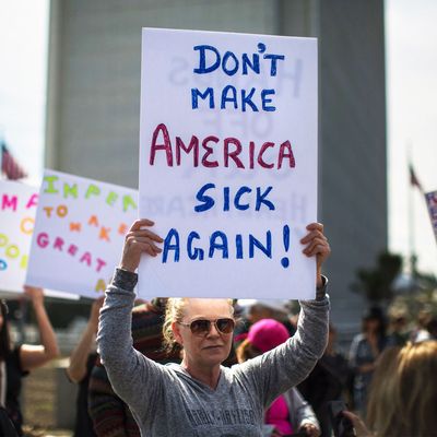 People protest Trump administration policies that threaten the Affordable Care Act, Medicare and Medicaid, near the Wilshire Federal Building on January 25, 2017 in Los Angeles, California.