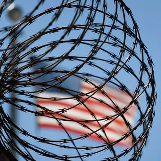 GUANTANAMO BAY, CUBA - OCTOBER 27: (EDITORS NOTE: Image has been reviewed by U.S. Military prior to transmission.) A roll of protective wire rings a detainee camp inside the U.S. military prison for 