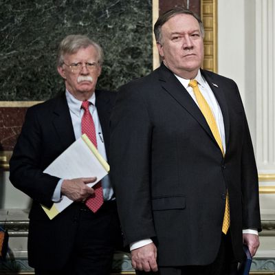 Pompeo (yellow tie) and Bolton ('stache).