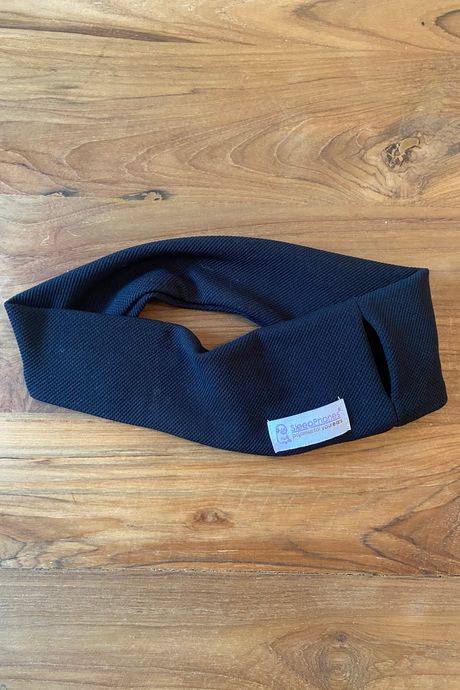 A black headband on a table.